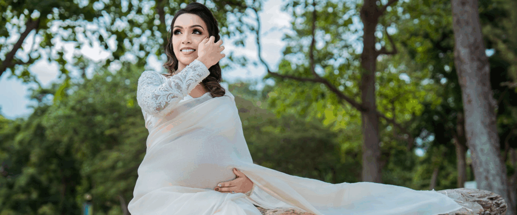Maternity photoshoot Singapore in a scenic outdoor park setting.