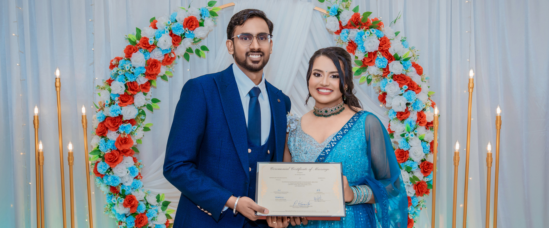 Couple holding marriage certificates after ROM solemnisation in Singapore, shared as inspiration for ROM Singapore 2026