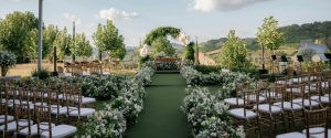 Garden Wedding Venues in Singapore with elegant outdoor ceremony setup, floral aisle and arch decor